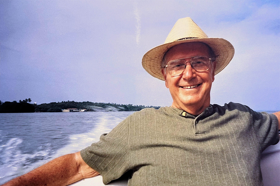 LMU chemistry alum Paul Hiemenz smiling on boat